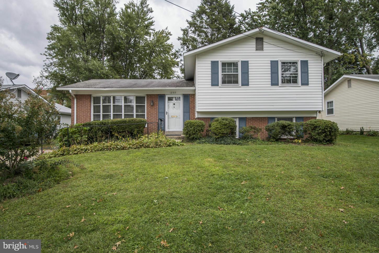 12515 Barbara Road Silver Spring, MD 20906 - Photo 1 of 8 a front view of a house with garden
