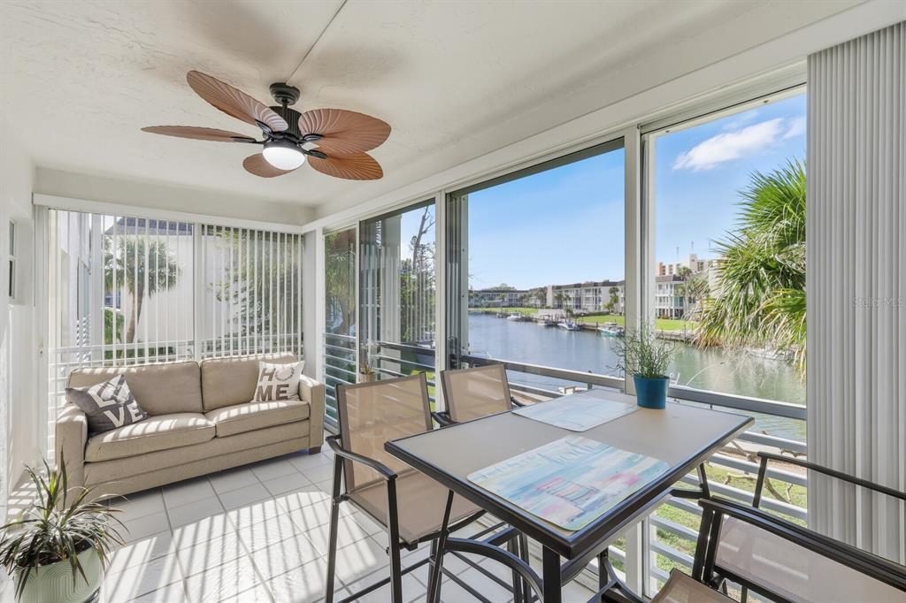 4380 Exeter Drive, Unit H202 Longboat Key, FL 34228 - Photo 1 of 37 a living room with furniture and a large window