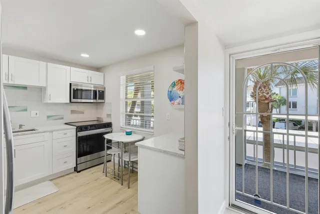 a view of a hallway with windows