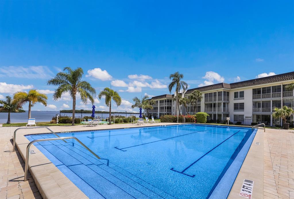 4380 Exeter Drive, Unit H202 Longboat Key, FL 34228 - Photo 31 of 37 a view of house with outdoor space and swimming pool