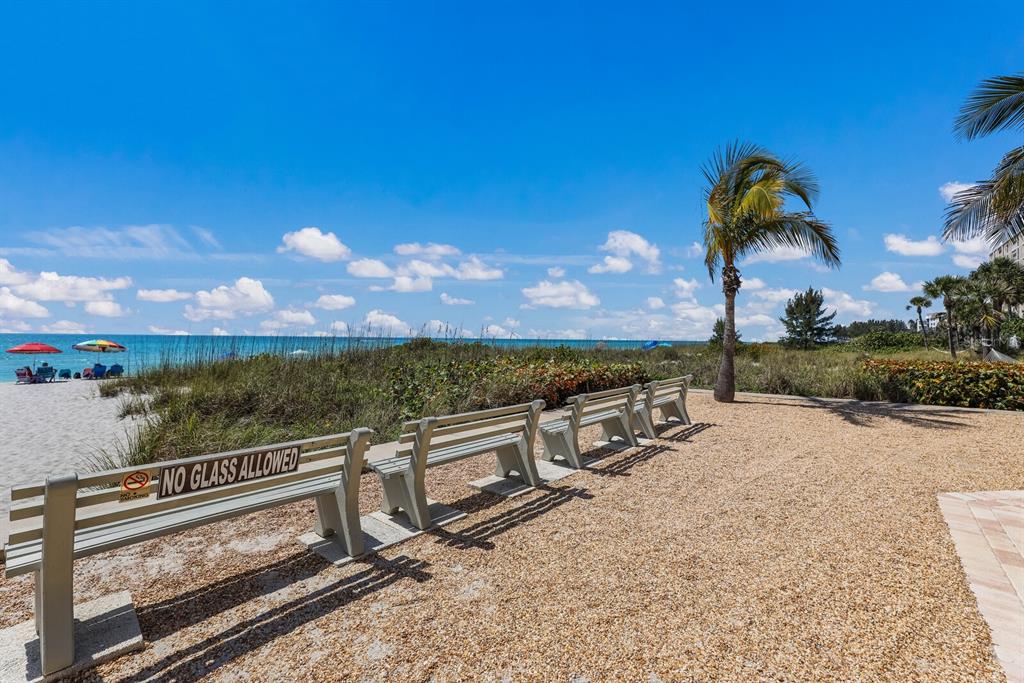 4380 Exeter Drive, Unit H202 Longboat Key, FL 34228 - Photo 36 of 37 a view of a terrace with a bench