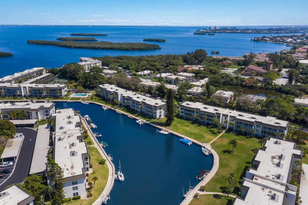 4380 Exeter Drive, Unit H202 Longboat Key, FL 34228 - Photo 4 of 37 an aerial view of residential houses with outdoor space