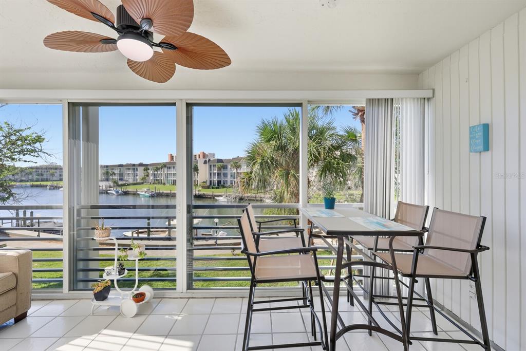 4380 Exeter Drive, Unit H202 Longboat Key, FL 34228 - Photo 7 of 37 a view of a dining room with furniture window and outside view
