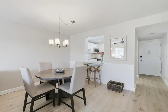 a kitchen with stainless steel appliances granite countertop a refrigerator sink and stove