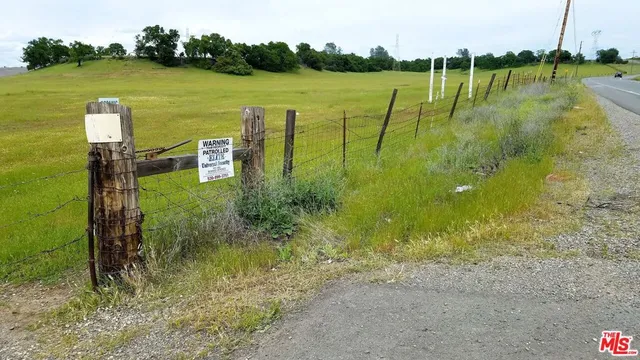 a view of a lake with a yard