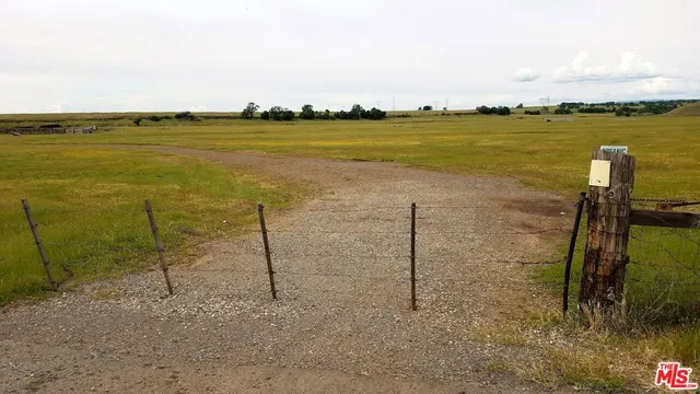 a view of a lake with houses in the back