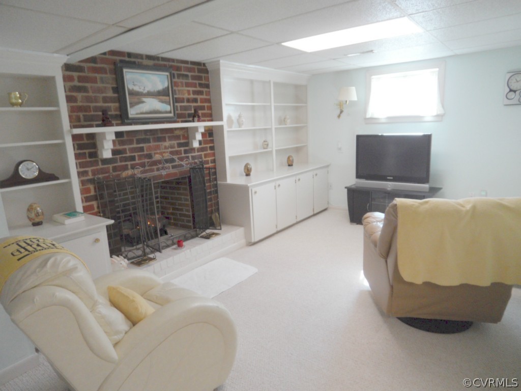 7118 Barkbridge Road Chesterfield, VA 23832 - Photo 11 of 24 a living room with furniture and a fireplace