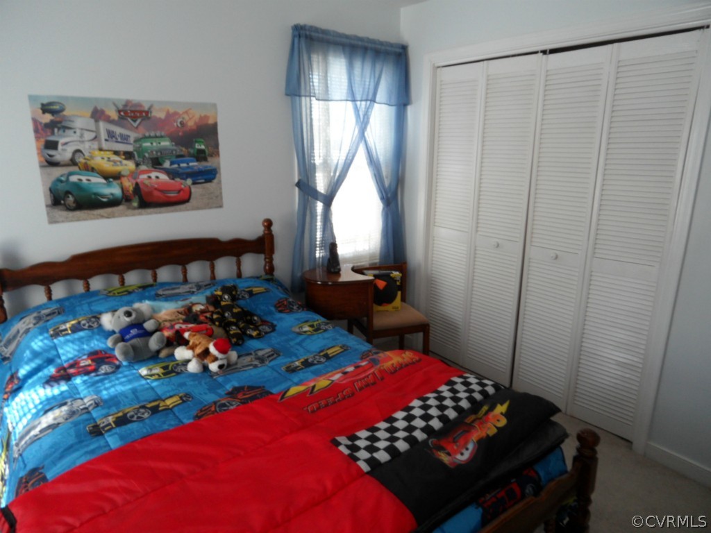 7118 Barkbridge Road Chesterfield, VA 23832 - Photo 16 of 24 a bedroom with a bed and a window in it
