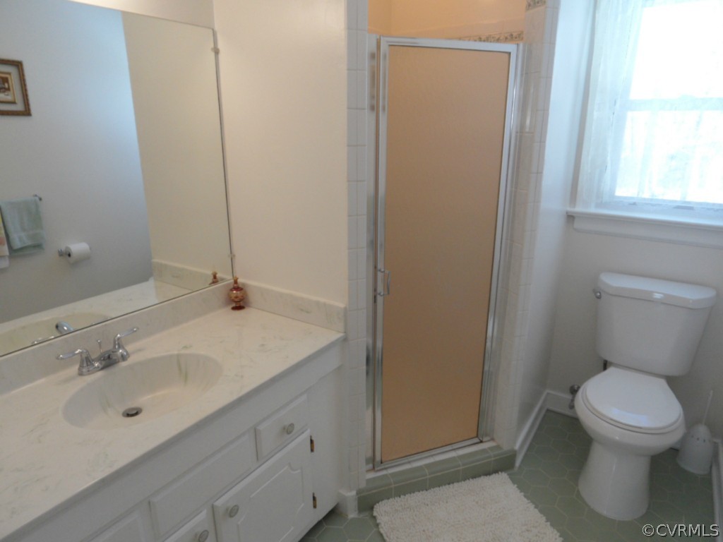 7118 Barkbridge Road Chesterfield, VA 23832 - Photo 24 of 24 a bathroom with a sink a toilet and a mirror