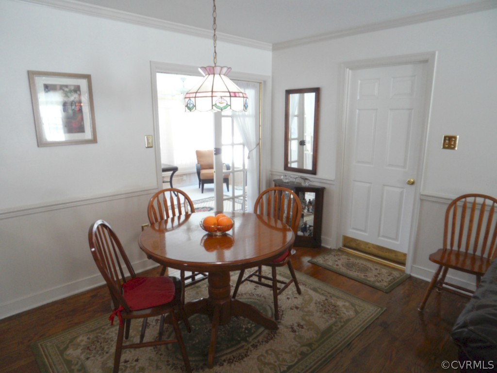7118 Barkbridge Road Chesterfield, VA 23832 - Photo 7 of 24 a dining room with furniture a chandelier and wooden floor