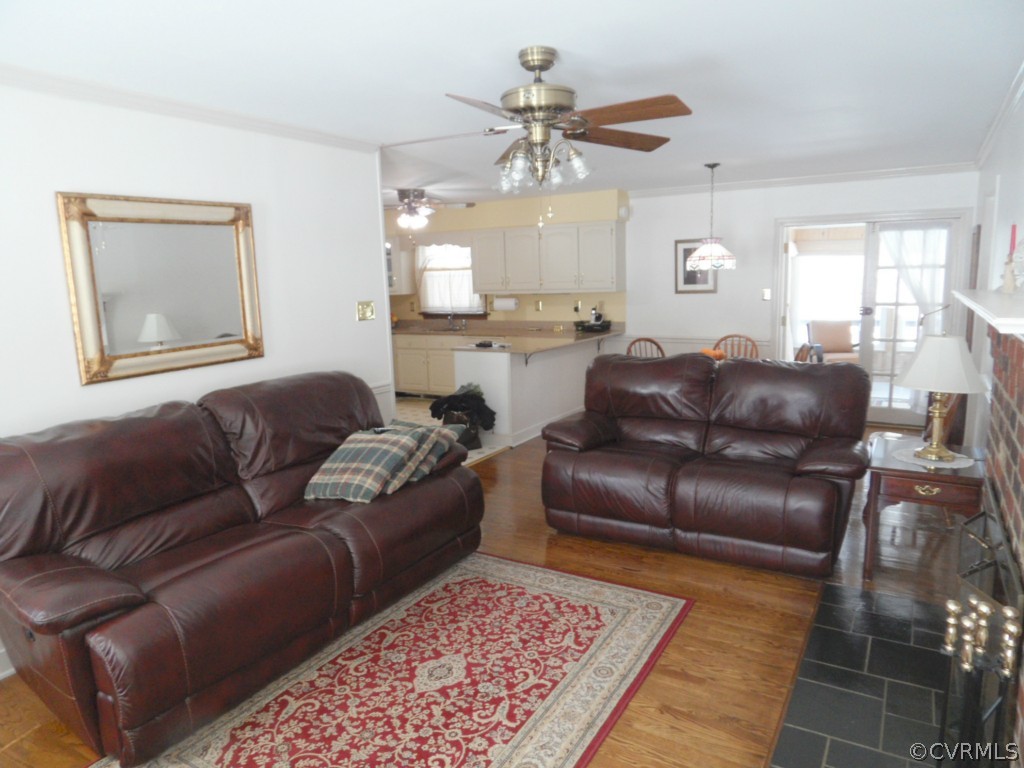 7118 Barkbridge Road Chesterfield, VA 23832 - Photo 8 of 24 a living room with a couch and chandelier