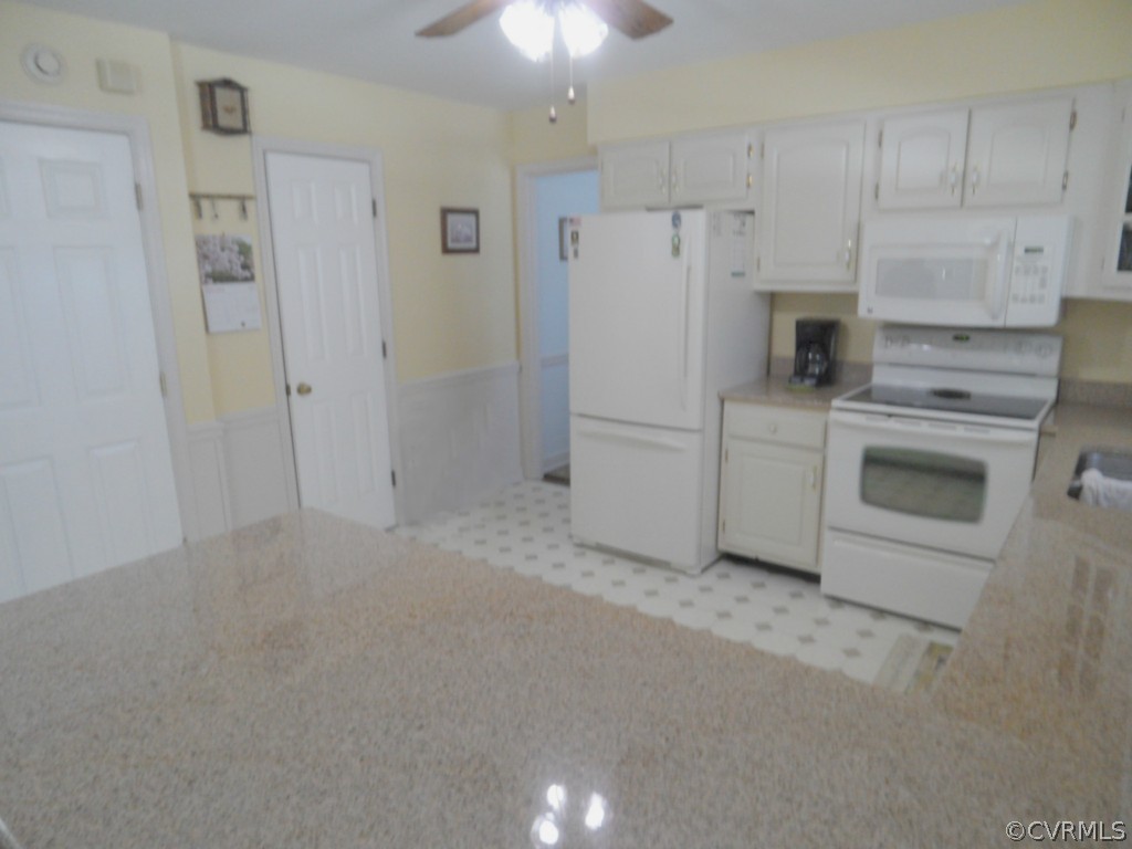 7118 Barkbridge Road Chesterfield, VA 23832 - Photo 10 of 24 a kitchen with cabinets and stainless steel appliances