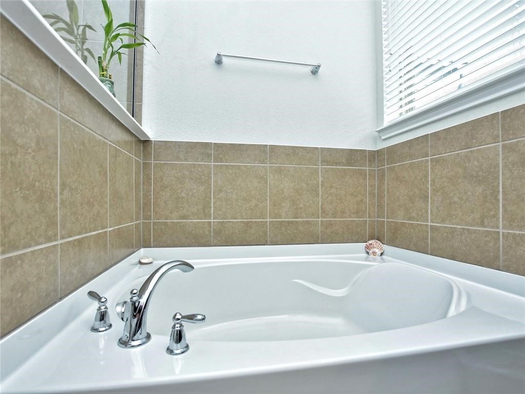 305 Methodius Drive Hutto, TX 78634 - Photo 15 of 26 a bathroom with a bathtub