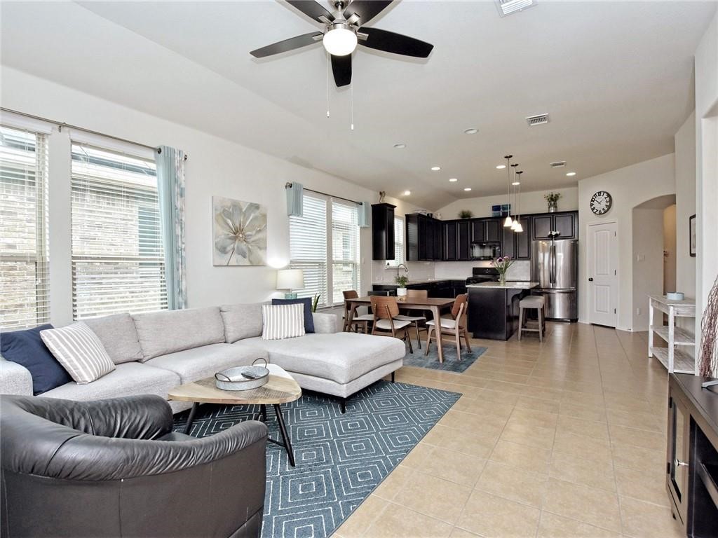 305 Methodius Drive Hutto, TX 78634 - Photo 2 of 26 a living room with furniture and a large window