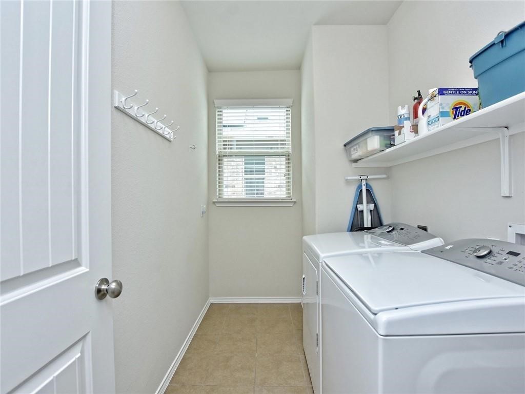 305 Methodius Drive Hutto, TX 78634 - Photo 21 of 26 a utility room with dryer and washer