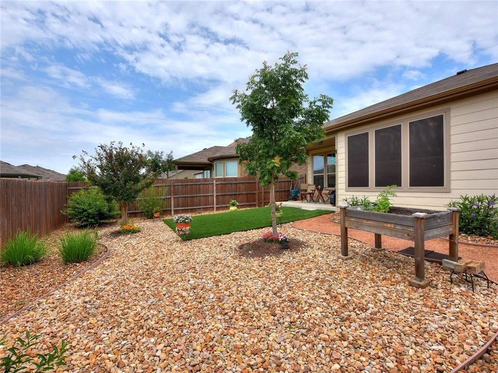 305 Methodius Drive Hutto, TX 78634 - Photo 25 of 26 a house view with a sitting space and garden