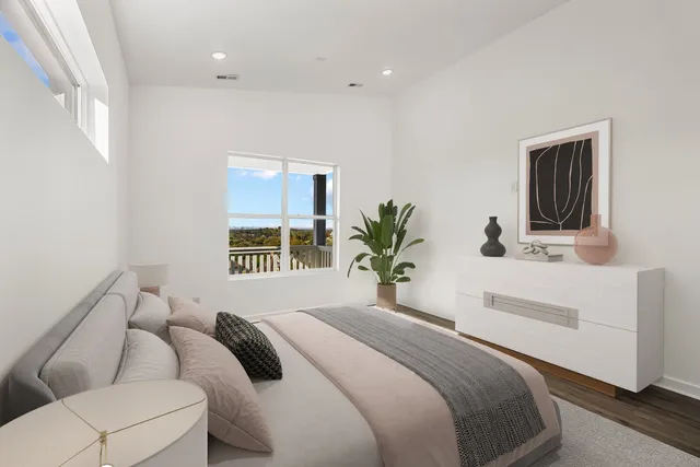 a bedroom with a large bed and a couch