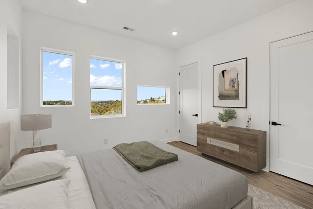 a bedroom with a bed and a couch