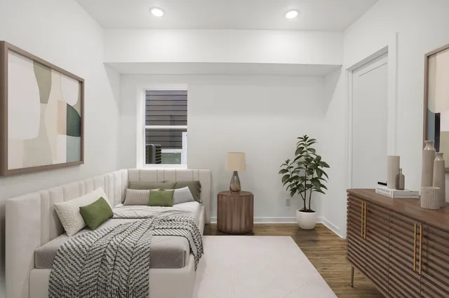 a bedroom with a large bed and a couch