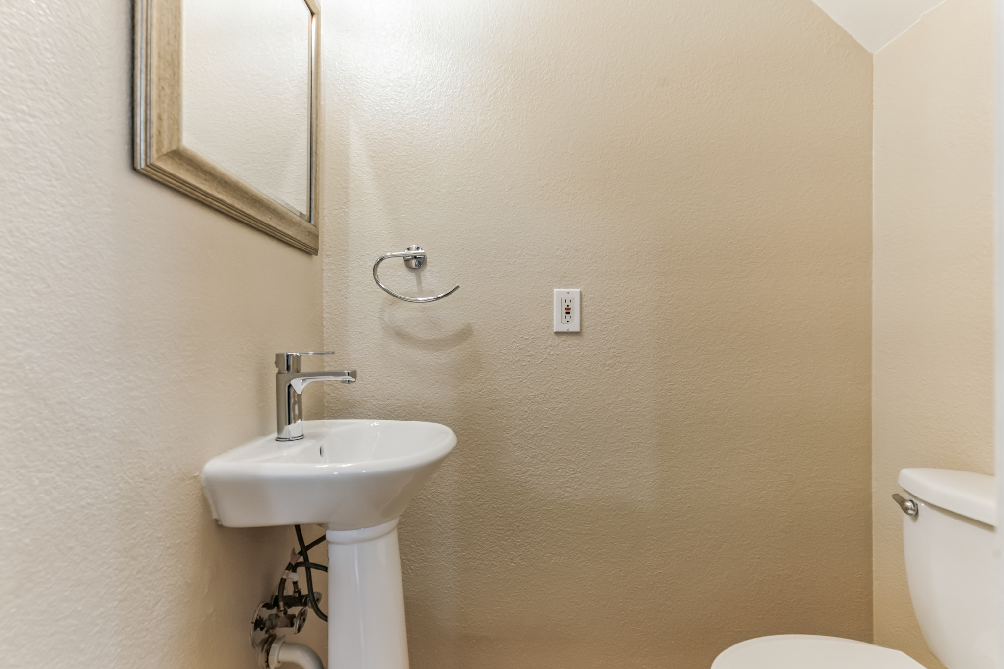 3214 Clawson Road, Unit A Austin, TX 78704 - Photo 8 of 26 A well-appointed powder room with a sleek pedestal sink.