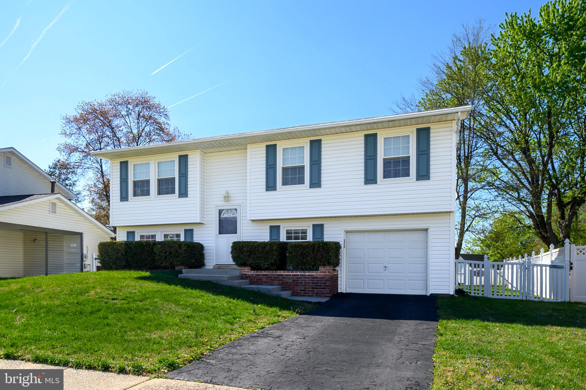 982 Fall Cir Way Gambrills, MD 21054 - Photo 2 of 32 a front view of a house with a yard and garage