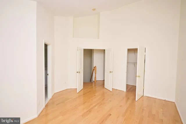 a view of a room with wooden floor