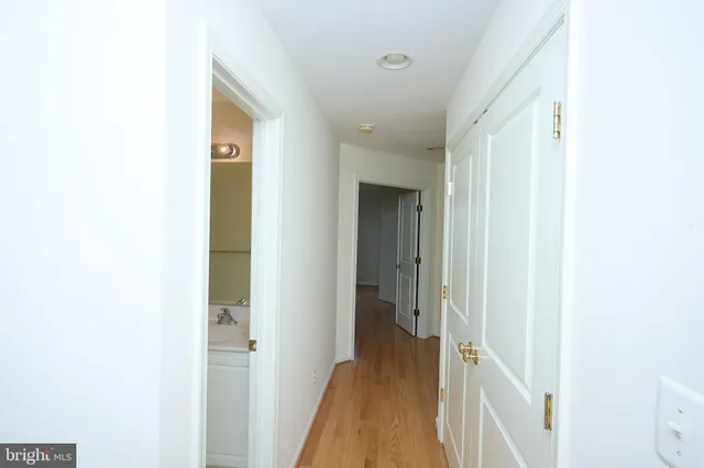 a view of a hallway with a white walls