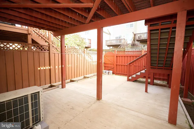 a view of a porch with furniture and next to a window