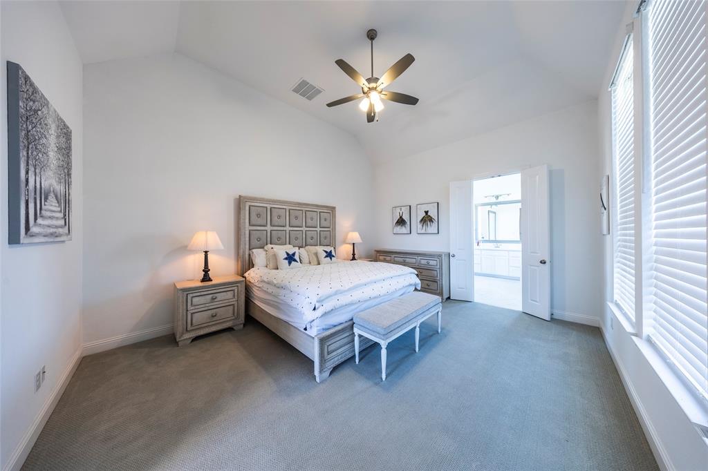 1650 Oakcrest Drive Prosper, TX 75078 - Photo 20 of 40 Bedroom with carpet flooring, lofted ceiling, a ceiling fan, and ensuite bathroom