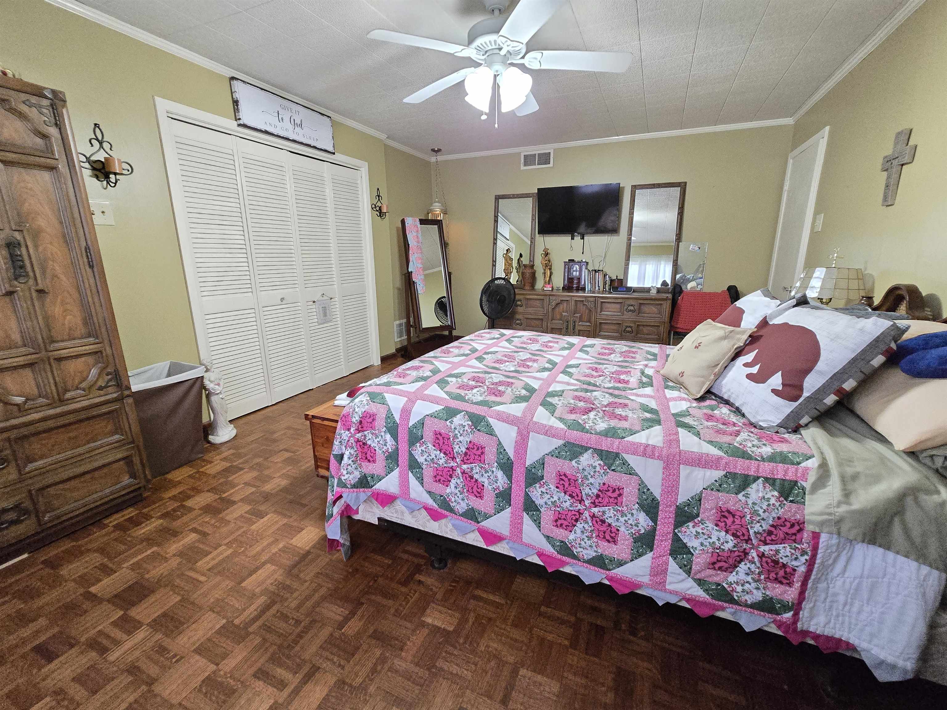 4885 Macon Road Memphis, TN 38122 - Photo 6 of 39 a bedroom with a bed and a mirror on the dresser