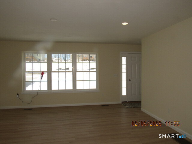 73 Warm Earth Road Naugatuck, CT 06770 - Photo 3 of 24 a view of an empty room with a window