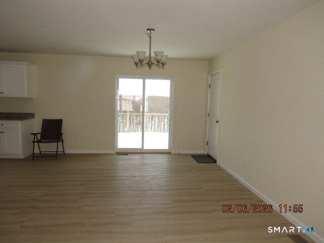 73 Warm Earth Road Naugatuck, CT 06770 - Photo 4 of 24 a view of an empty room with a window