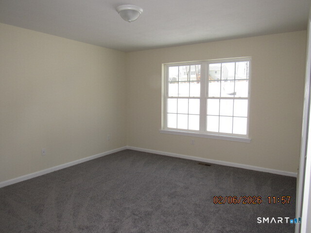 73 Warm Earth Road Naugatuck, CT 06770 - Photo 8 of 24 an empty room with a window