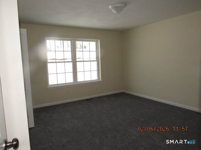 73 Warm Earth Road Naugatuck, CT 06770 - Photo 9 of 24 an empty room with a window