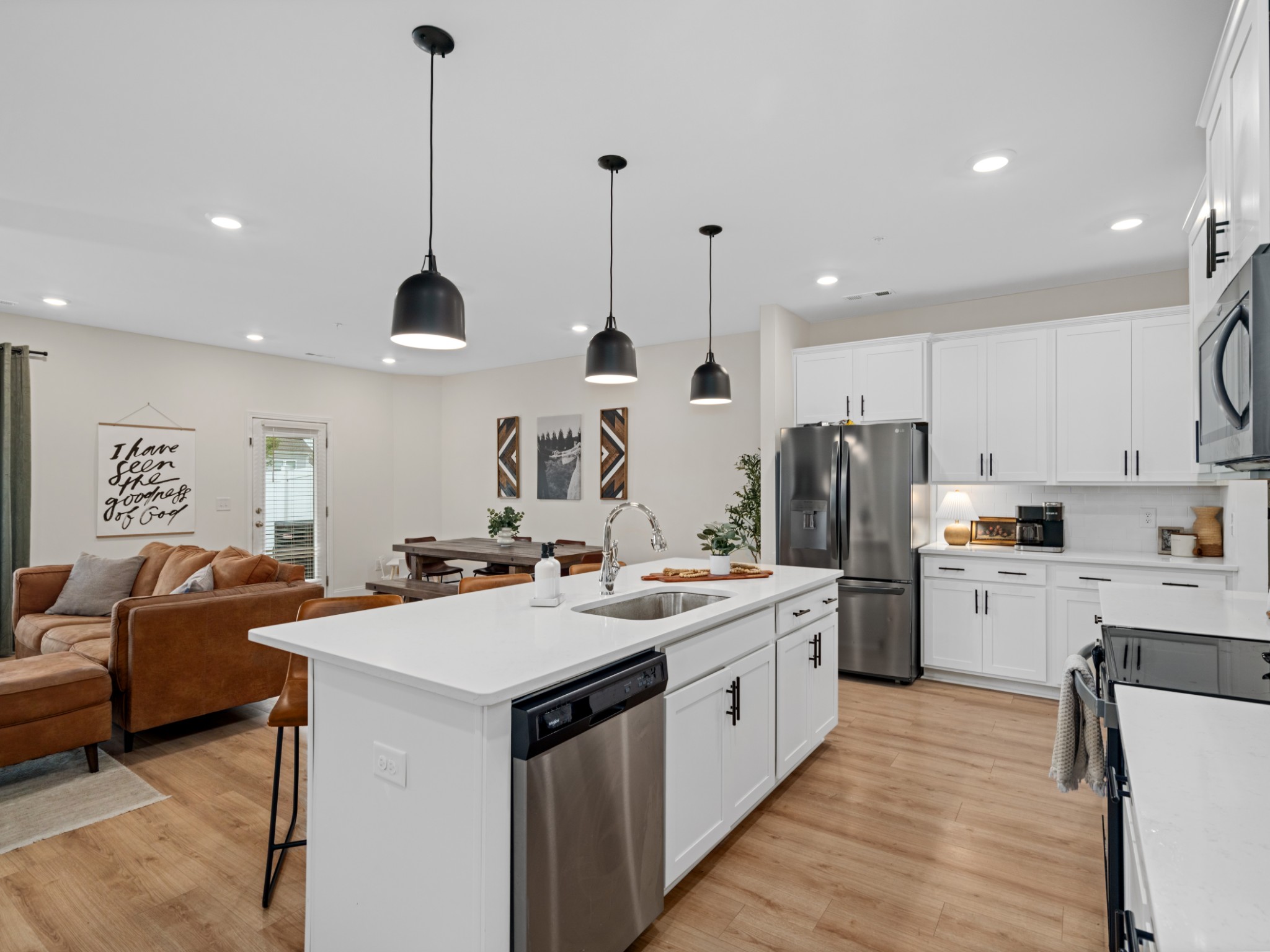 1043 June Wilde Ridge Spring Hill, TN 37174 - Photo 12 of 35 a kitchen with a sink a counter top space stainless steel appliances and cabinets