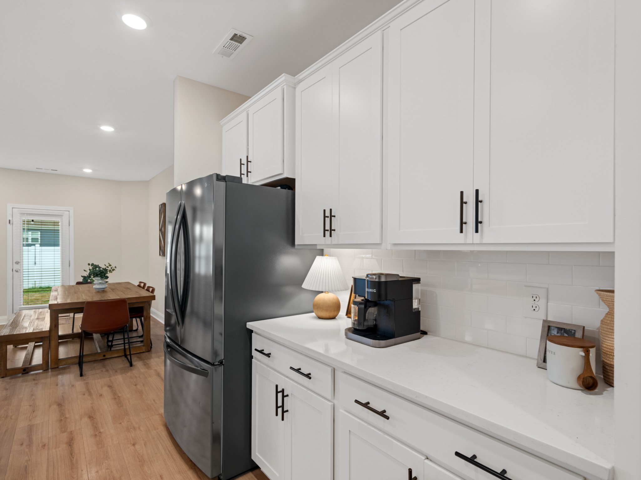 1043 June Wilde Ridge Spring Hill, TN 37174 - Photo 13 of 35 a kitchen with a refrigerator and cabinets