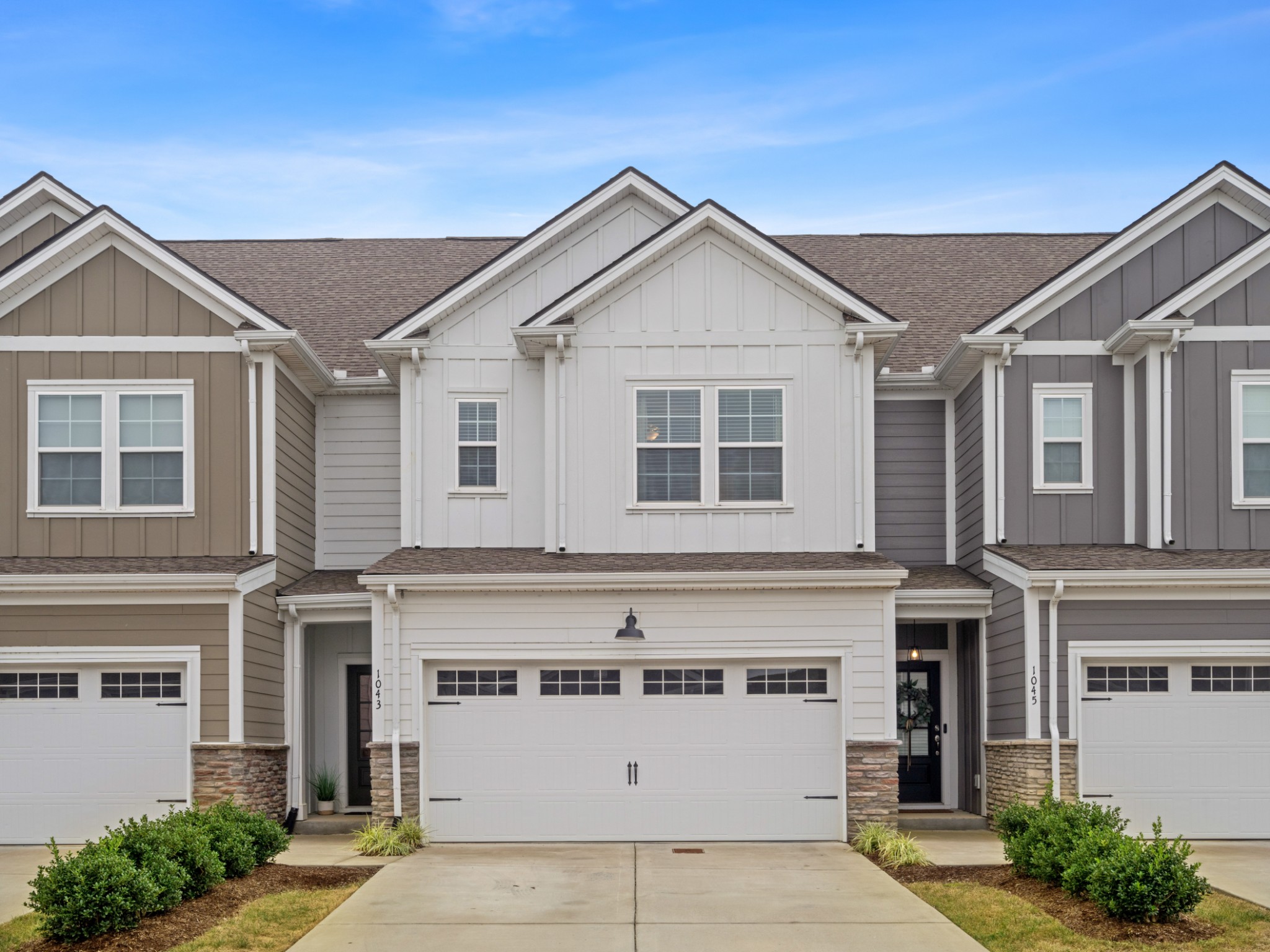 1043 June Wilde Ridge Spring Hill, TN 37174 - Photo 2 of 35 a view of a white house with large windows