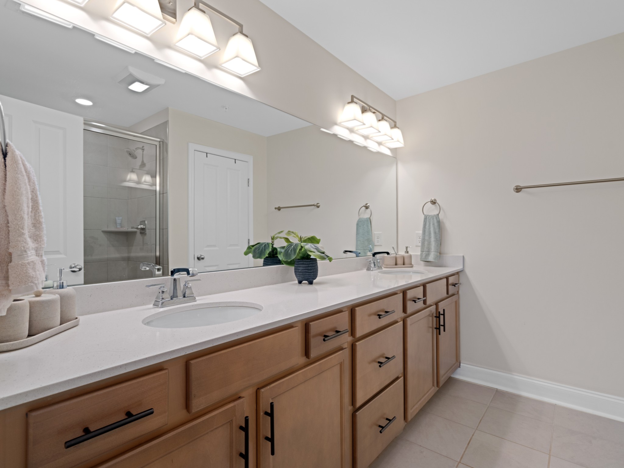 1043 June Wilde Ridge Spring Hill, TN 37174 - Photo 26 of 35 a bathroom with a double vanity sink and a mirror