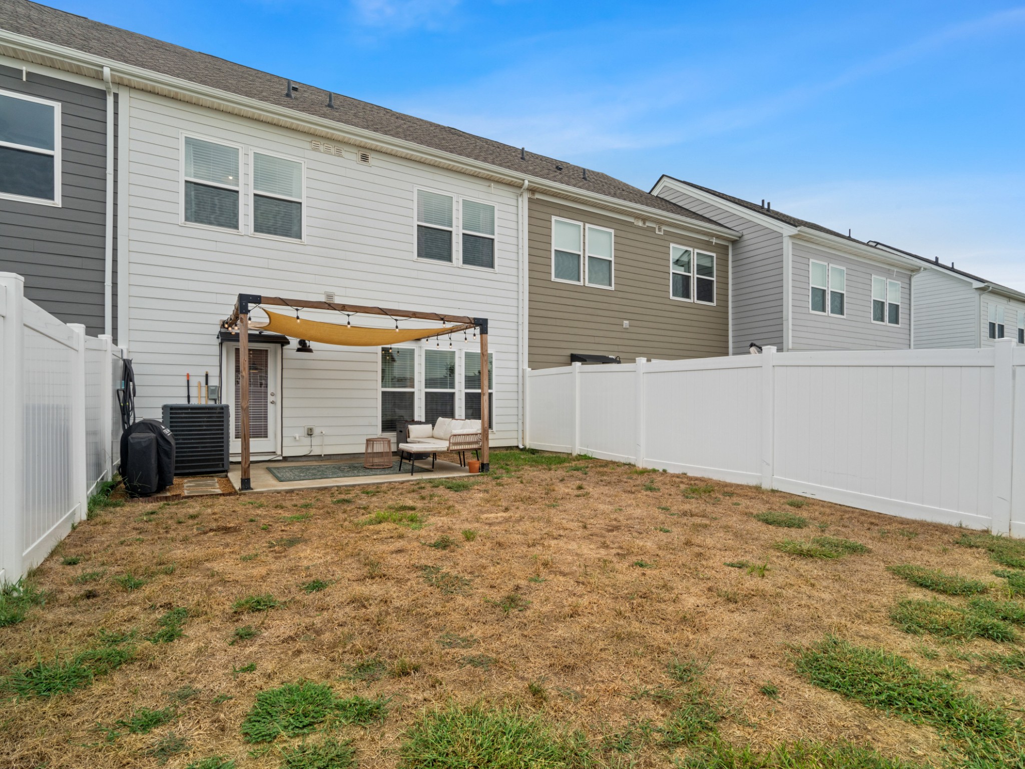 1043 June Wilde Ridge Spring Hill, TN 37174 - Photo 33 of 35 a view of a house with backyard and a tree