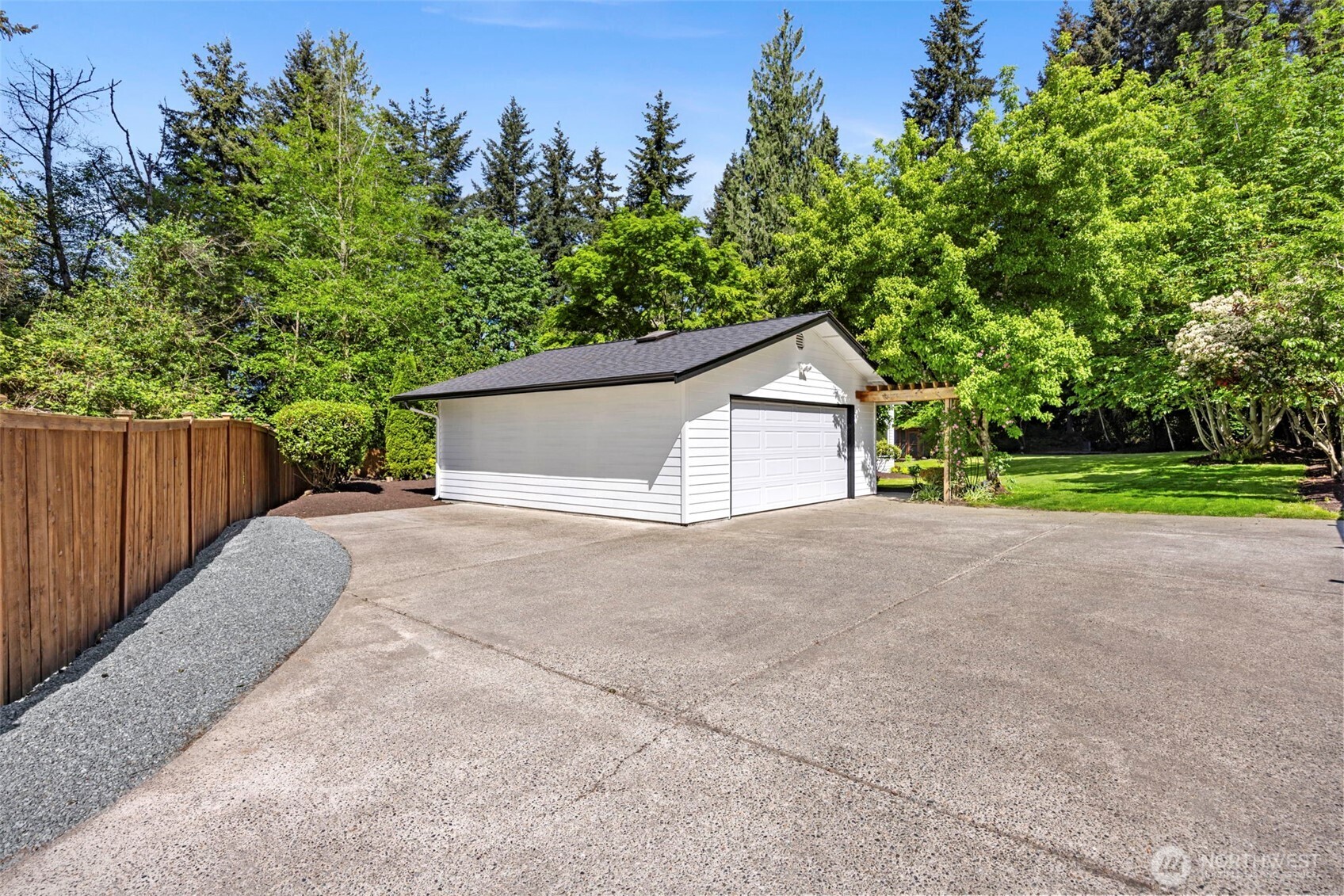 121 West Winesap Road Bothell, WA 98012 - Photo 26 of 29 a house with trees in the background