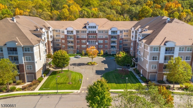 a view of a city with tall buildings and a yard