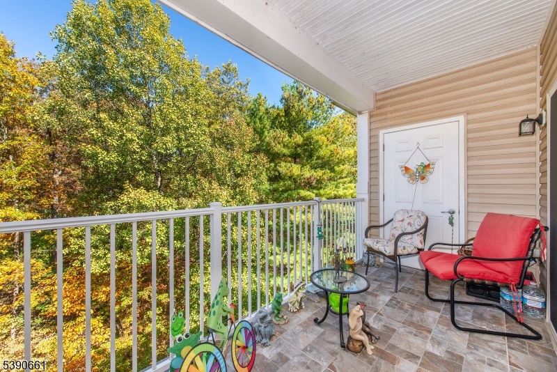 1407 Warren's Way Wanaque, NJ 07465 - Photo 14 of 36 a balcony with chairs and with potted plants