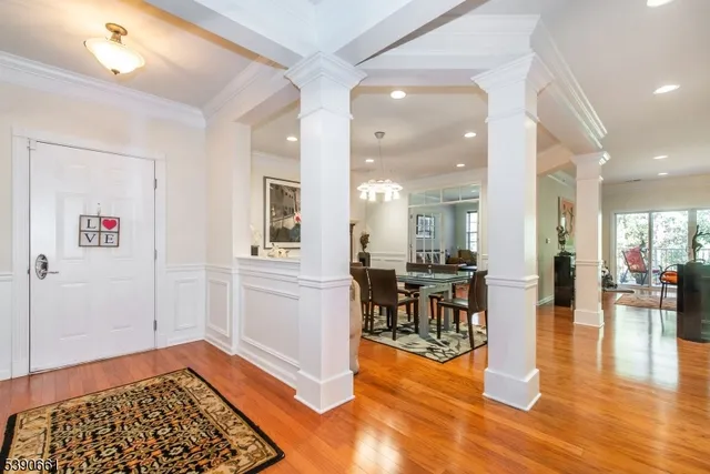 a view of a dining area with furniture and wooden floor