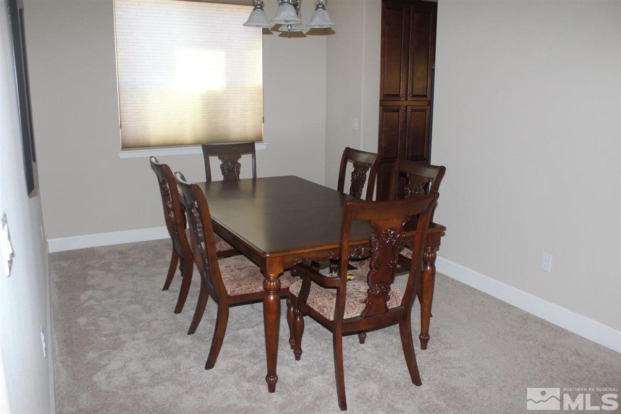 1655 Heavenly View Trail Reno, NV 89523 - Photo 11 of 39 a view of a dining room with furniture and a window