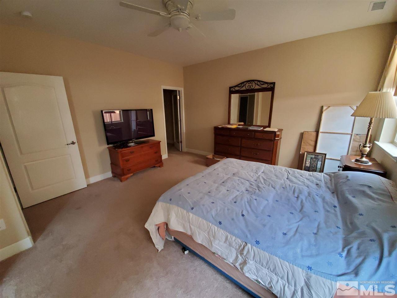 1655 Heavenly View Trail Reno, NV 89523 - Photo 13 of 39 a bed room with a bed and a television