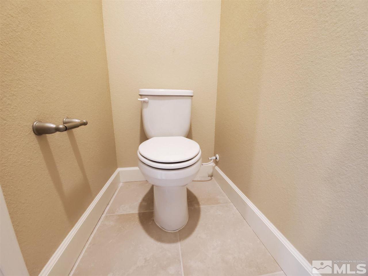1655 Heavenly View Trail Reno, NV 89523 - Photo 16 of 39 a bathroom with a toilet and a rug