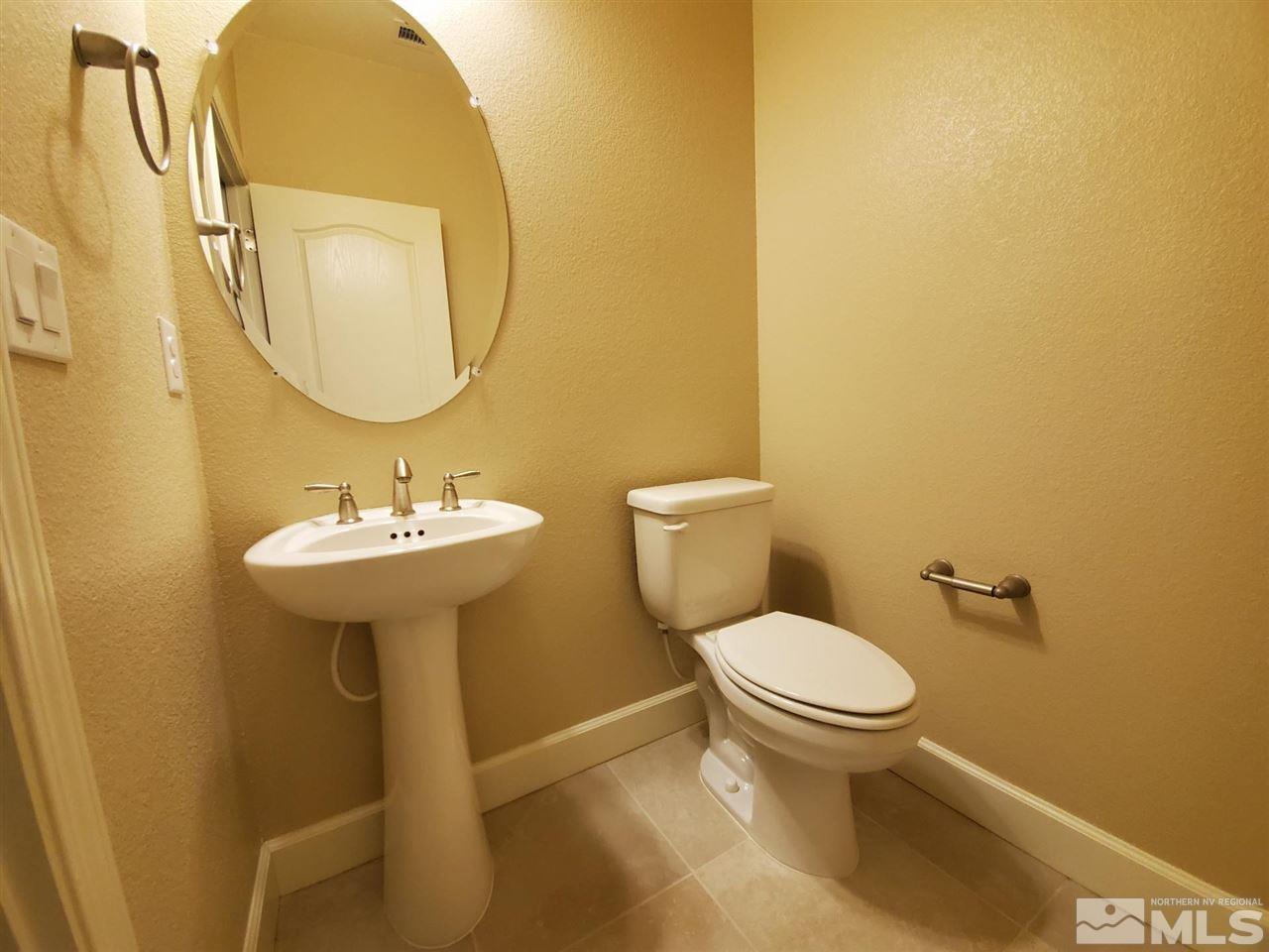 1655 Heavenly View Trail Reno, NV 89523 - Photo 26 of 39 a bathroom with a toilet sink and mirror