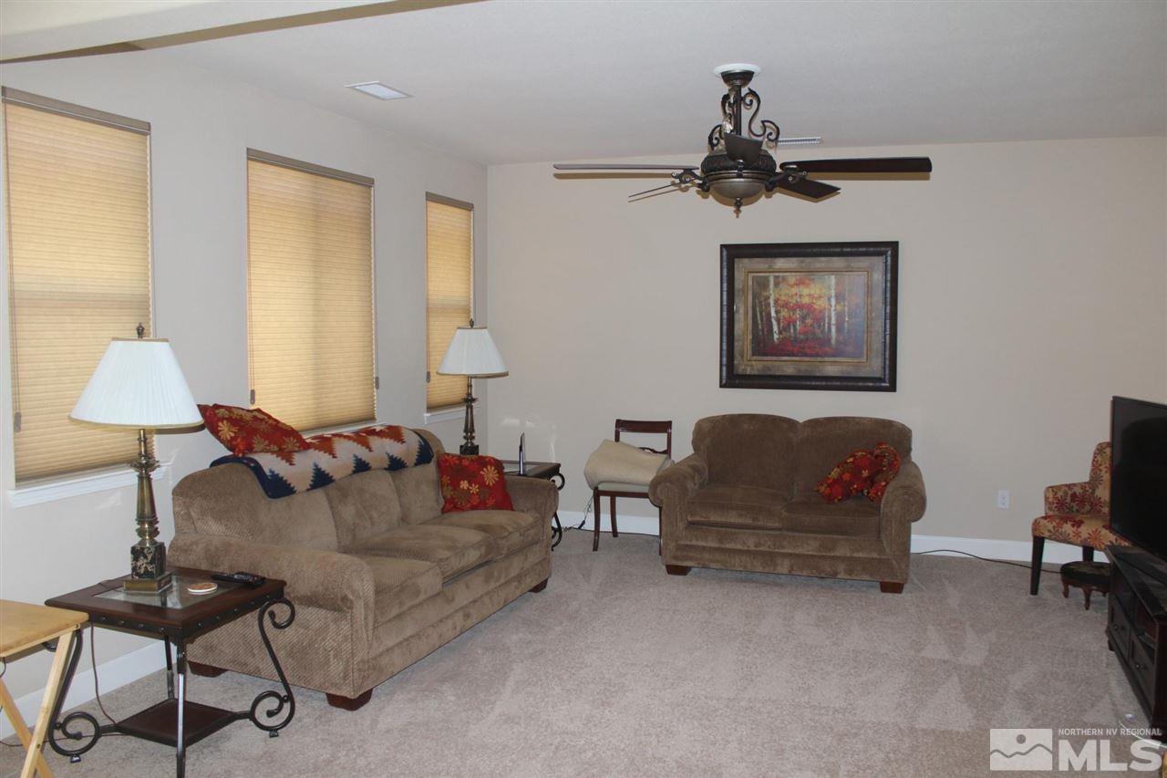 1655 Heavenly View Trail Reno, NV 89523 - Photo 7 of 39 a living room with furniture and a window