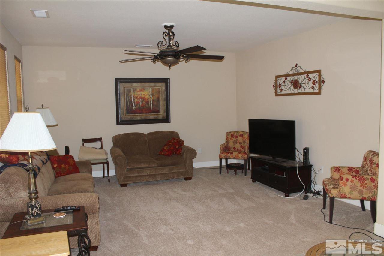 1655 Heavenly View Trail Reno, NV 89523 - Photo 8 of 39 a living room with furniture and a flat screen tv