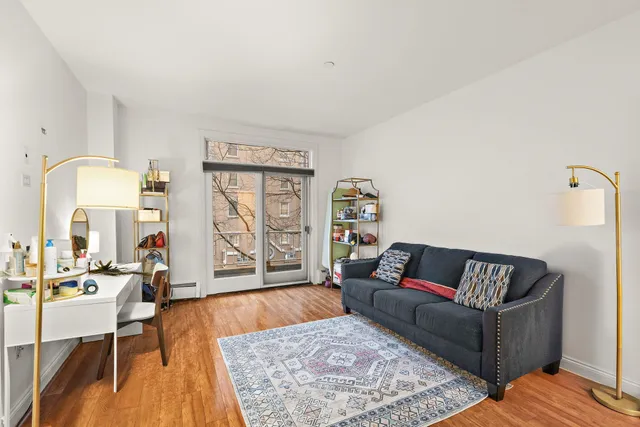 a bathroom with a sink toilet a mirror and shower